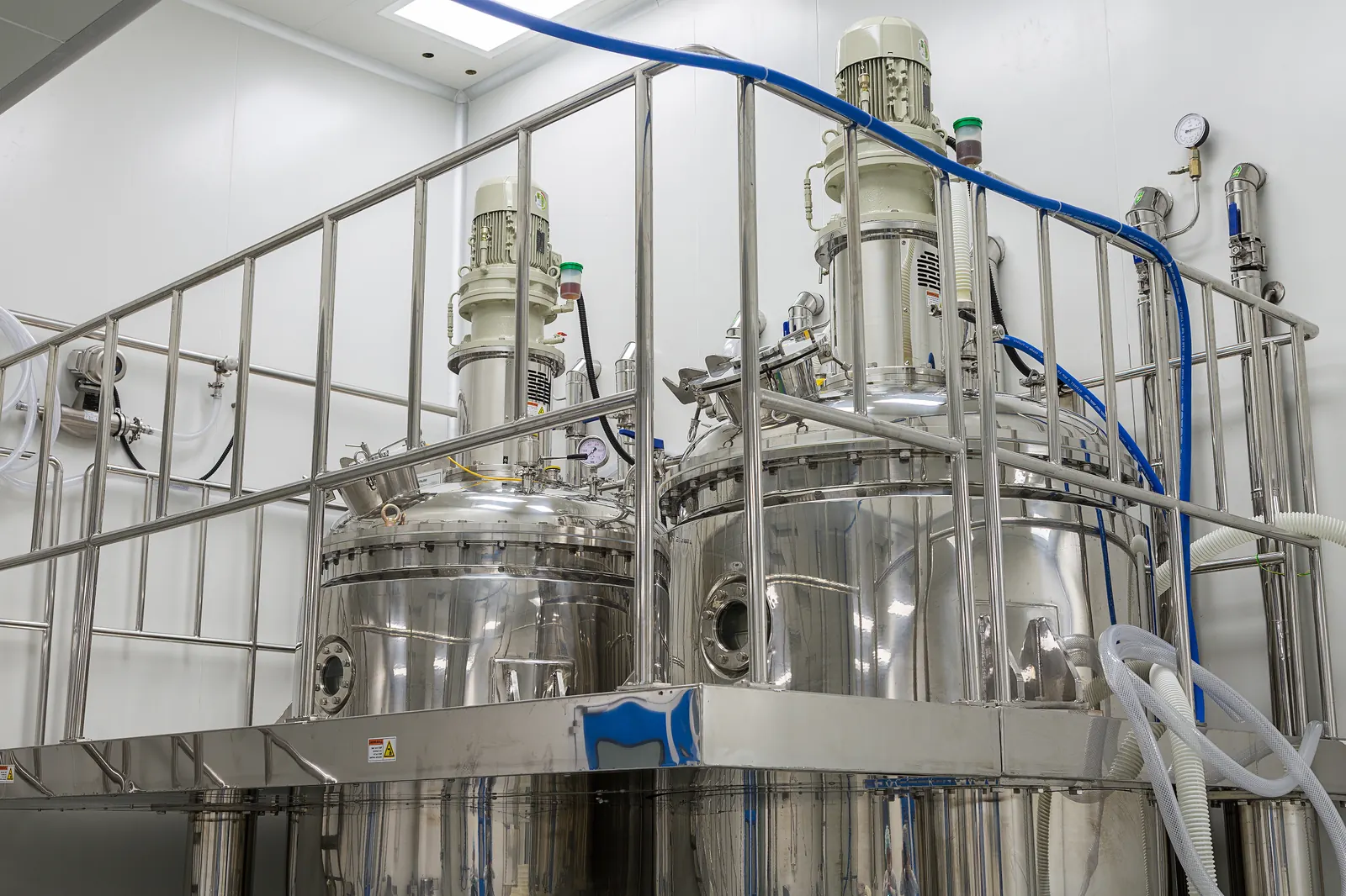 Stainless steel reactors in a chemical production room